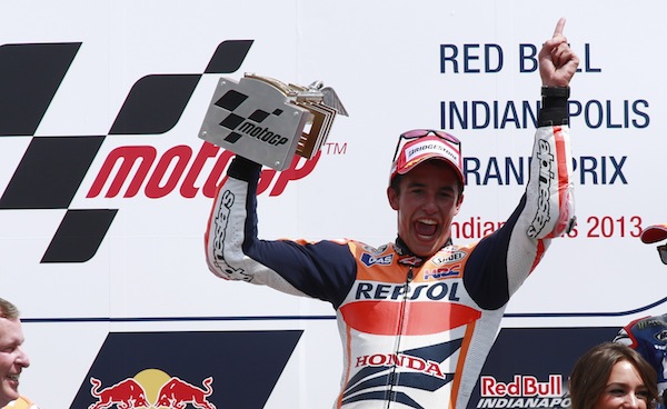 Honda MotoGP rider Marc Marquez of Spain hoists the winneru00e2u20acu2122s trophy on the podium after his win at the Indianapolis Grand Prix in Indianapolis August 18, 2013. u00e2u20acu201d Reuters pic