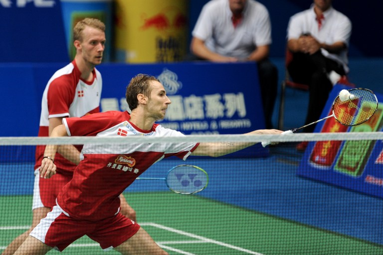 Denmark's Mathias Boe (R) and Carsten Mogensen (L) return to South Korea's Kim Ki Jung and Kim Sa Rang during their men's doubles semi-final at World Badminton Championships in Guangzhou, south China's Guangdong province on August 10, 2013. u00e2u20acu201d AFP pic