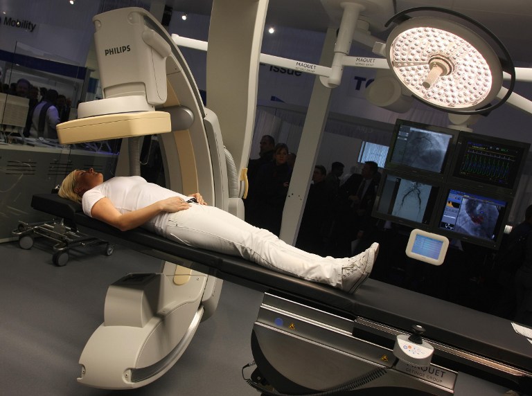 A woman lies in a hybrid operating theatre which allows computer tomography diagnosis even during surgery at the 'Medica World Forum for Medicine' (MEDICA) fair on November 18, 2010 in Duesseldorf, western Germany. u00e2u20acu201d AFP pic