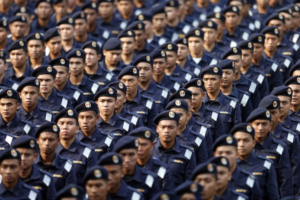 Members of Malaysiau00e2u20acu2122s maritime forces march during National Day celebrations marking the 56th anniversary of the countryu00e2u20acu2122s independence in Kuala Lumpur August 31, 2013. u00e2u20acu201d Reuters pic