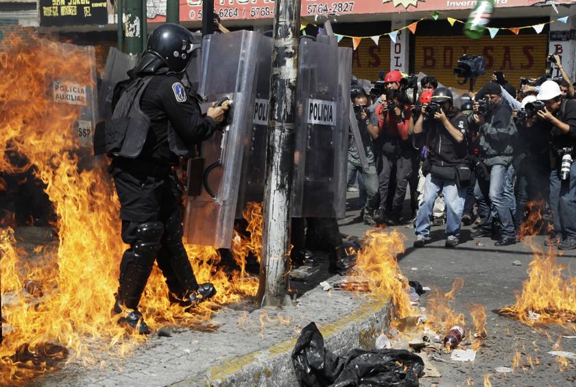 Riot police are engulfed in flames after protesters threw molotov cocktails during a protest march in Mexico City September 2, 2013. u00e2u20acu201c Reuters pic