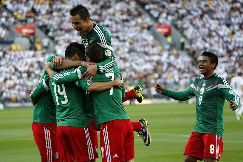 Mexico’s players celebrate a goal against New Zealand during their 2014 World Cup qualifying playoff second leg match at Westpac Stadium in Wellington November 20, 2013. — Reuters pic