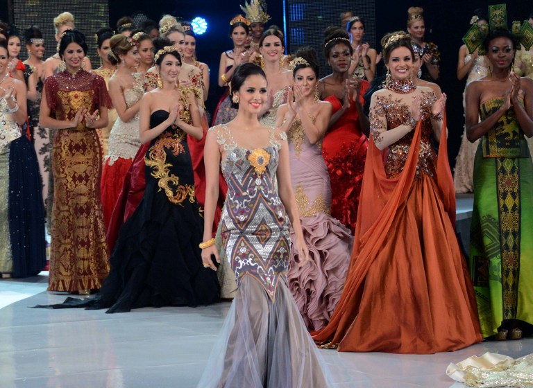 Miss Philippines Megan Young (centre) walks on the catwalk during the fashion show of Miss World contestants in Nusa Dua, September 24, 2013. She has just been crowned Miss World 2013 in the finals.  u00e2u20acu201d AFP pic