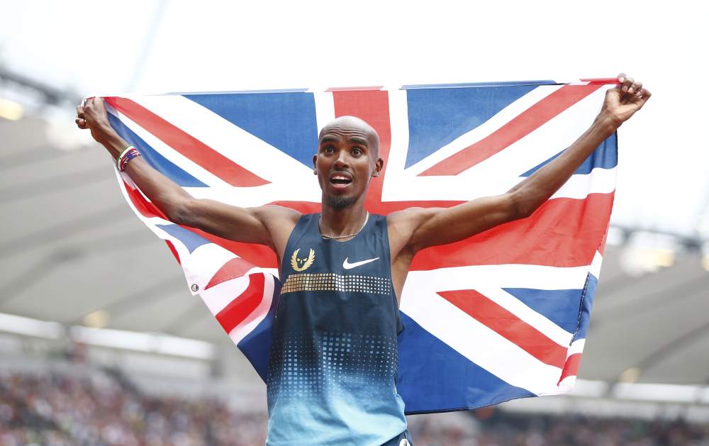 Mo Farah holds a union flag after winning the menu00e2u20acu2122s 3,000m at the London Diamond League Anniversary Games athletics meeting at the Olympic Stadium, in London on July 27, 2013. u00e2u20acu201d Reuters pic