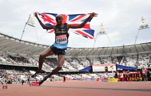 Mo Farah of Great Britain jumps in the air after winning in the menu00e2u20acu2122s 3,000 metres event during the London Anniversary Games in London on July 27, 2013. u00e2u20acu201d AFP pic