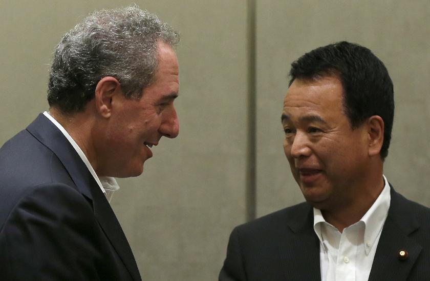 The man behind Japans biggest reforms push: Akira Amari greeting US Trade Representative Michael Froman for lunch in Tokyo August 19, 2013, before they sit down to talks. — Reuters file pic