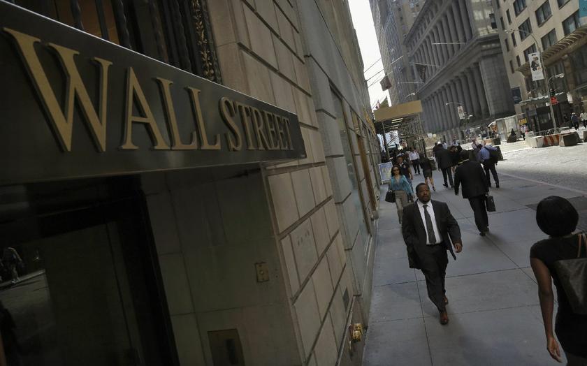 Morning commuters walk on Wall Street in New York's financial district September 5, 2013. -- Reuters