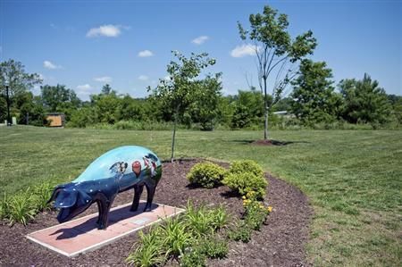 A painted pig stands on the lawn of Smithfield Foods executive offices in Smithfield, Virginia May 30, 2013. Taken over by Shuanghui International if China Reuters pic