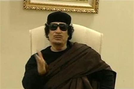 Muammar Gaddafi gestures as he speaks at a Tripoli hotel in this still image from a video by Libyan TV released May 11, 2011. u00e2u20acu201c Reuters pic