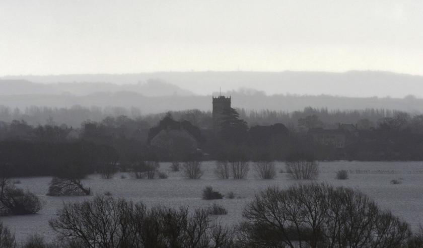 Rain falls as the village of Muchelney is seen on the flooded Somerset Levels, near Langport in south west England January 27, 2014.