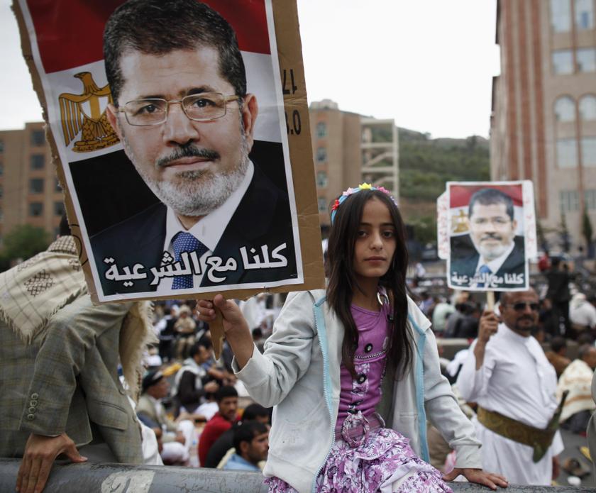 A girl holds a poster of Egypt's deposed Islamist President Mohamed Mursi during a rally in protest of the recent violence in Egypt, in Sanaa August 16, 2013. u00e2u20acu201c Reuters pic