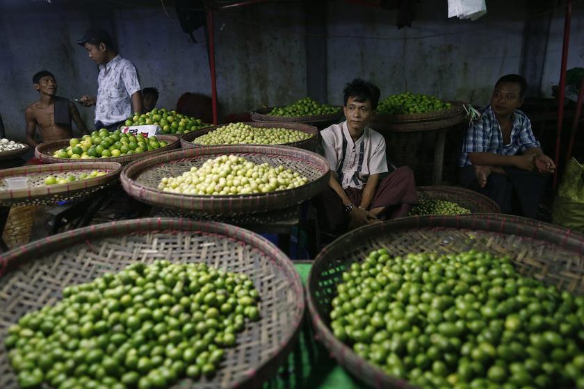 Vendors sell vegetables at Thiriminglar market, one of Myanmaru00e2u20acu2122s biggest wholesale vegetable markets, in Yangon October 14, 2013. u00e2u20acu201d Reuters pic