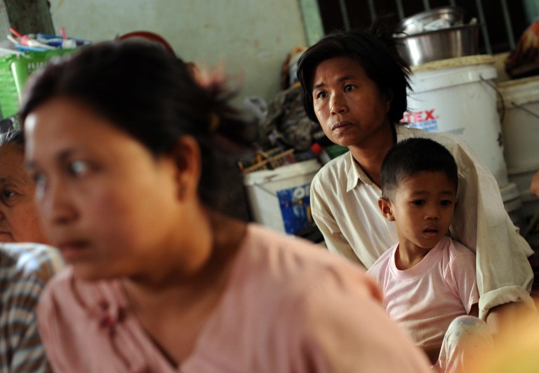Displaced people rest at a relief camp after an outbreak of communal violence claimed at least 32 lives and displaced about 9,000 people in Meiktila, central Myanmar on March 24, 2013. u00e2u20acu201c AFP pic