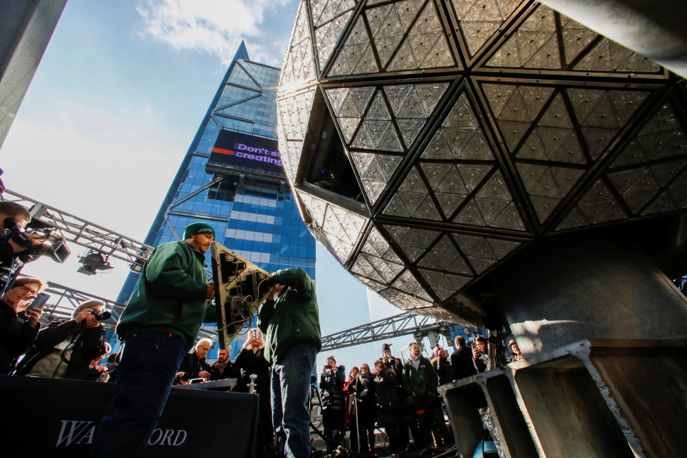 Workers get ready to install Waterford Crystal triangles on the Times Square New Year's Eve Ball on the roof of One Times Square in the Manhattan borough of New York, U.S., December 27, 2018. REUTERS/Eduardo Munoz
