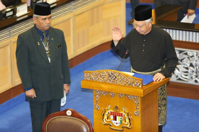 Prime Minister Datuk Seri Najib Razak takes the oath as an MP of the 13th Parliament in Kuala Lumpur on June 24, 2013. u00e2u20acu201d Picture by Saw Siow Feng