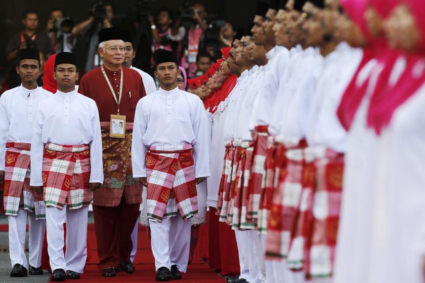 Umno president Datuk Seri Najib Razak inspects the honour guard during the United Malays National Organisation annual general assembly at Putra World Trade Centre in Kuala Lumpur December 5, 2013. u00e2u20acu201d Reuters pic