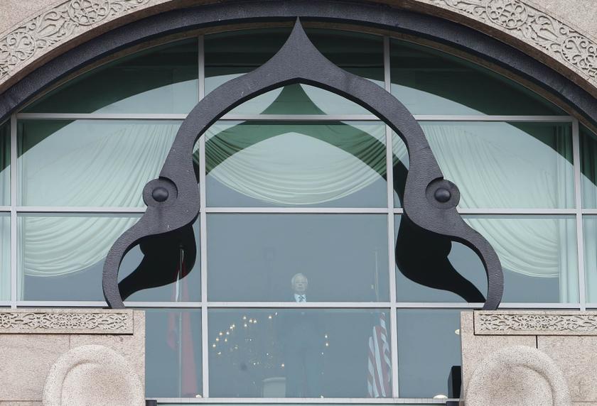 Malaysia's Prime Minister Datuk Seri Najib Razak is seen through the glass at his office in Putrajaya, January 10, 2014. u00e2u20acu201d Reuters pic