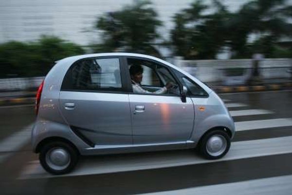 A Nano car belonging to one of its first owners drives down a road in Mumbai on July 17, 2009. u00e2u20acu201d Reuters pic