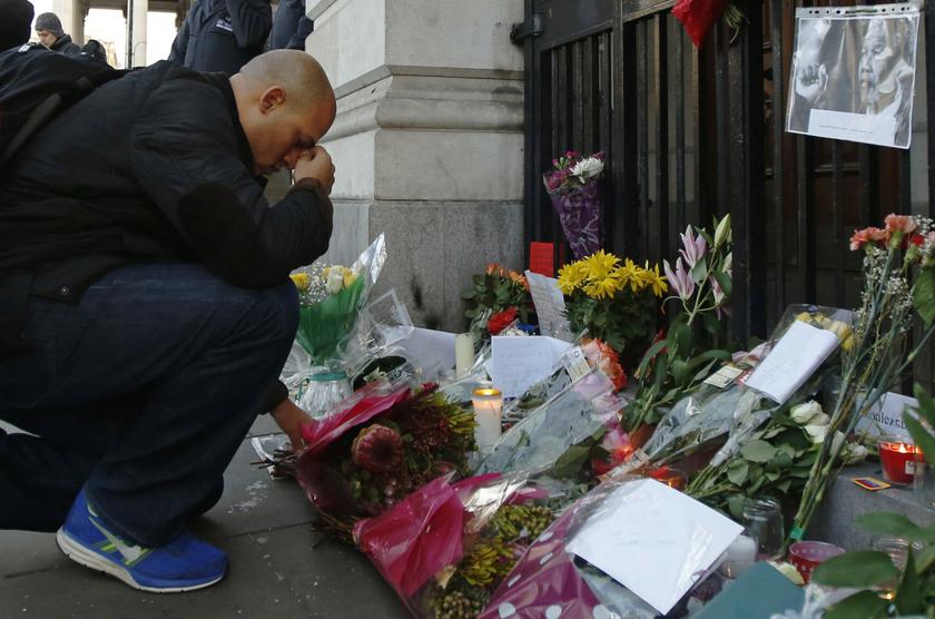 A man pays respect in front of floral tributes left for former South African President Nelson Mandela at the South African High Commission in London December 6, 2013. u00e2u20acu201d Reuters pic