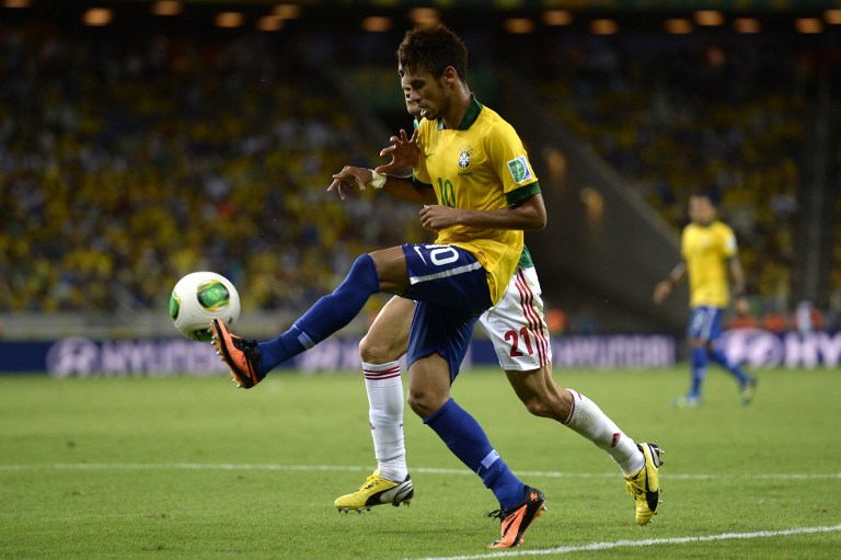 Brazil's forward Neymar controls the ball during their FIFA Confederations Cup Brazil 2013 Group A football match against Mexico, at the Castelao Stadium in Fortaleza, on June 19, 2013. 