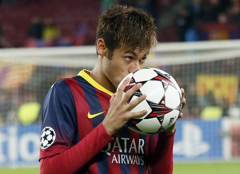 Barcelona's Neymar kisses the ball after scoring a hat-trick against Celtic as he leaves the pitch at the end of their Champions League match at Camp Nou stadium in Barcelona December 11, 2013. u00e2u20acu201d Reuters pic