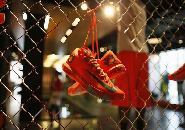 Shoes are displayed in the Nike store in Santa Monica, California, September 25, 2013. NIKE, Inc. plans to release its first quarter fiscal 2014 financial results today. u00e2u20acu201d Reuters pic