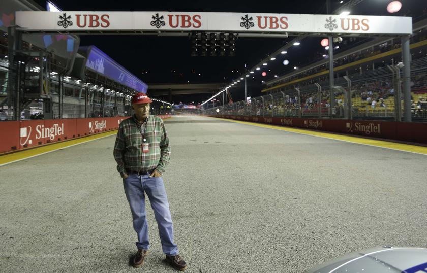 Former Formula One racing driver and three-time F1 World Champion, Niki Lauda of Austria, looks at the safety car in the starting line just before the start of the Singapore Formula One Grand Prix September 22, 2013. u00e2u20acu201d Reuters pic