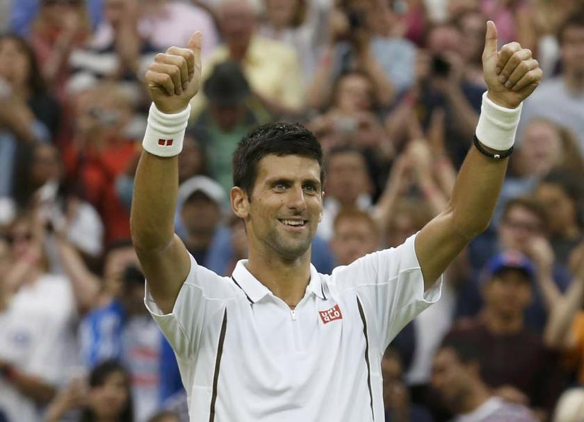 Novak Djokovic of Serbia celebrates after defeating Bobby Reynolds of the US in their menu00e2u20acu2122s singles tennis match at the Wimbledon Tennis Championships in London on June 27, 2013. u00e2u20acu201d Reuters pic
