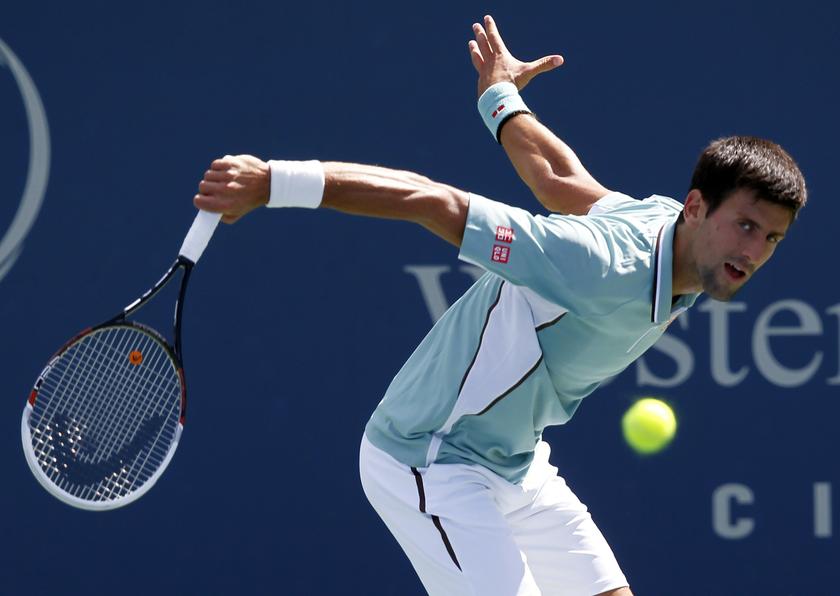 Novak Djokovic of Serbia hits a return to Juan Monaco of Argentina at the men's Cincinnati Open tennis tournament in Cincinnati, Ohio August 14, 2013. u00e2u20acu201c Reuters pic