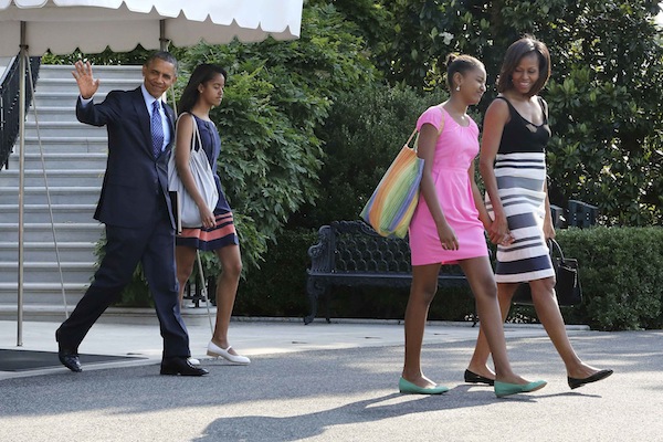 US President Barack Obama waves as he and his wife Michelle and daughters Malia (2nd left) and Sasha (2nd right) depart for travel to Africa, from the South Lawn of the White House in Washington, June 26, 2013 file photo. u00e2u20acu201d Reuters pic