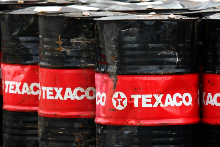 US oil giant Texaco barrels are pictured in Victoria harbour. u00e2u20acu201c AFP pic