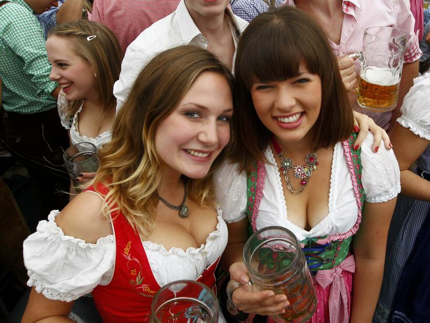 Two women wearing traditional Bavarian Dirndl dresses pose during the opening day the 180th Oktoberfest in Munich, Sept 21, 2013. u00e2u20acu201d Reuters pic