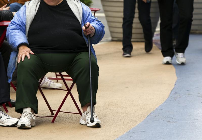 An overweight woman sits on a chair in Times Square in New York, May 8, 2012. u00e2u20acu201c Reuters pic