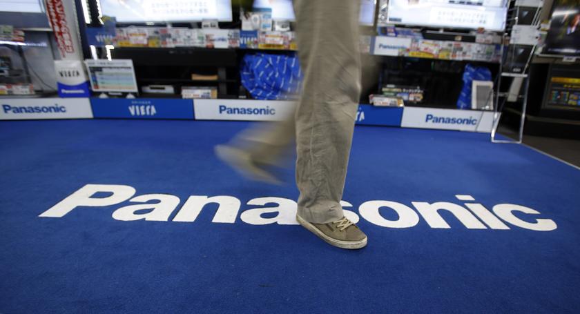 A shopper walks past a Panasonic Corp logo at an electronics retail store in Tokyo February 3, 2014. u00e2u20acu201d Reuters pic
