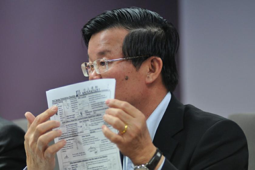 Chow Kon Yeow showing the release form for the customer to sign before taking part in any water sport activity. u00e2u20acu201du00c2u00a0Picture by K.E. Ooi