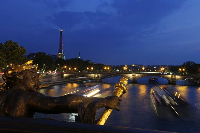 Tourist boats travel along the River Seine near the Alexandre III bridge and the Eiffel Tower in Paris on July 15, 2013. u00e2u20acu201d Reuters pic