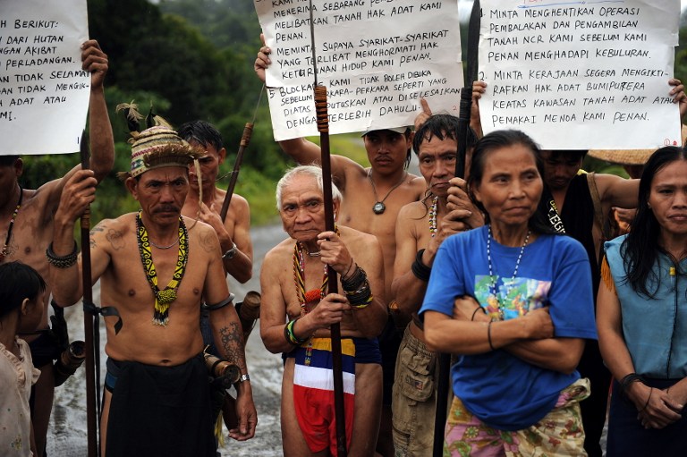 In a picture taken on August 20, 2009, Penan tribespeople man a blockade with banners and spears to challenge vehicles of timber and plantation companies in Long Nen in Malaysia's Sarawak State. u00e2u20acu201du00c2u00a0AFP pic