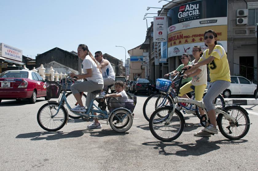 Tourists exploring central George Town on rented bicycles. — Picture by K.E. Ooi