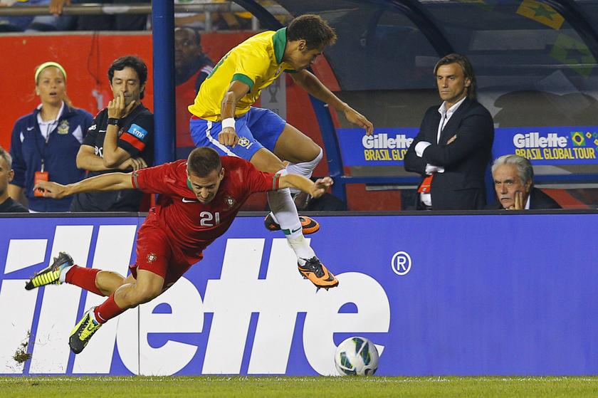 Portugal's Joao Pereira (left) and Brazil's Neymar fight for the ball during their international friendly soccer match in Foxborough, Massachusetts Sept 10, 2013. u00e2u20acu201d Reuters pic