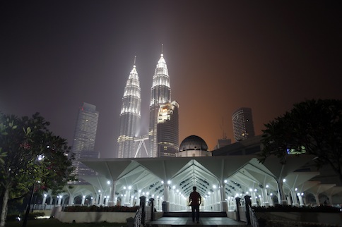 A man arrives for prayers at a mosque at the foot of Malaysiau00e2u20acu2122s landmark Petronas Twin Towers in Kuala Lumpur, in this June 23, 2013 file photo. u00e2u20acu201d Reuters pic