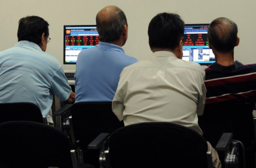 Public investors monitor trading at the gallery of the Philippine Stock Exchange in Manila on April 8, 2013. u00e2u20acu201d AFP pic