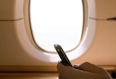 In a survey conducted by Skyscanner, 61 per cent of respondents said they would use their mobile devices during flights to make calls or send messages, if it were allowed. u00e2u20acu201d AFP pic