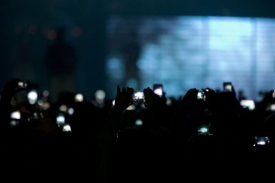 Young fans of Canadian singer Justin Bieber take photos during his concert as part of the 'Believe Tour' at Telenor Arena in Fornebu, Norway on April 16, 2013. - AFP pic