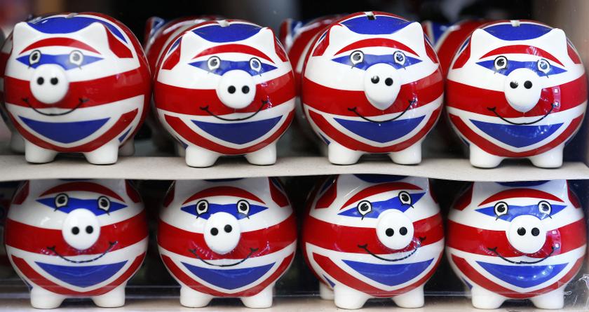 Smiling Union Jack piggy banks are lined up for sale in the window of a souvenir store on Oxford Street in central London January 20, 2014. u00e2u20acu201d Reuters pic