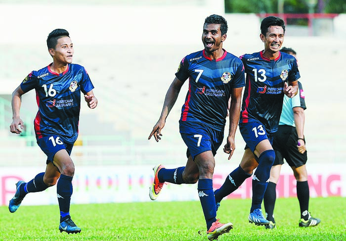 Police's Ashfaq Ali (centre) celebrates after scoring the only goal in their first goal in their FA Cup match against against Spa Putrajaya at MBPJ Stadium u00e2u20acu201d Picture by Razak Ghazali