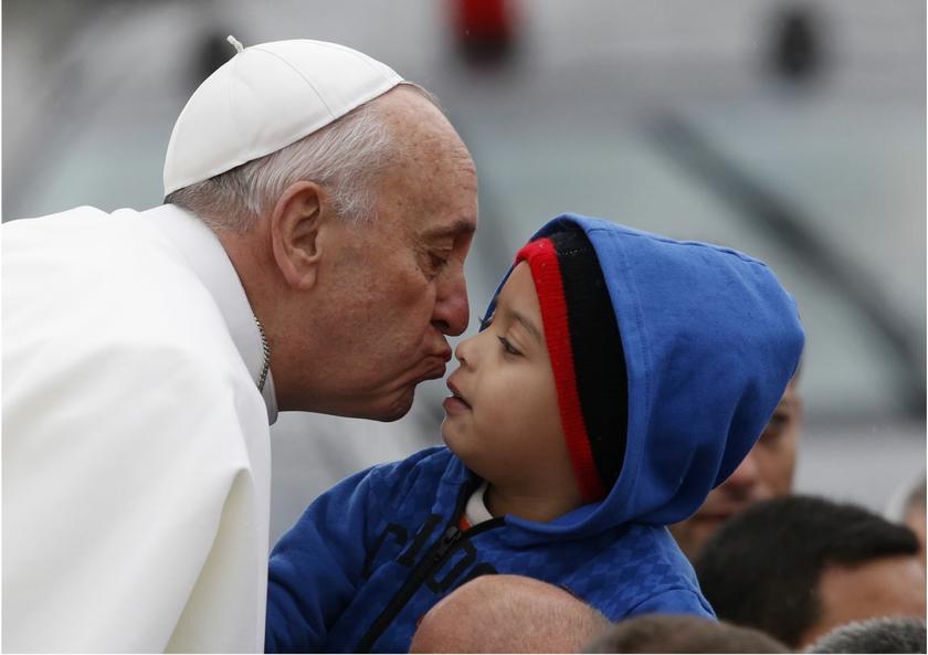 Pope Francis kisses a boy during his arrival at the shrine of the Madonna of Aparecida, who Catholics venerate as the patroness of Brazil, in Aparecida do Norte, Sao Paulo State, July 24, 2013