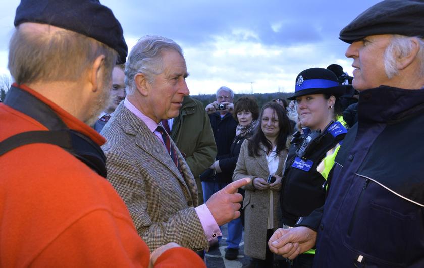 Britain's Prince Charles speaks with members of the local community in the village of Stoke St Gregory on the Somerset Levels on February 4, 2014. The prince visited flood-hit communities in the south west of England today. u00e2u20acu201d Reuters pic