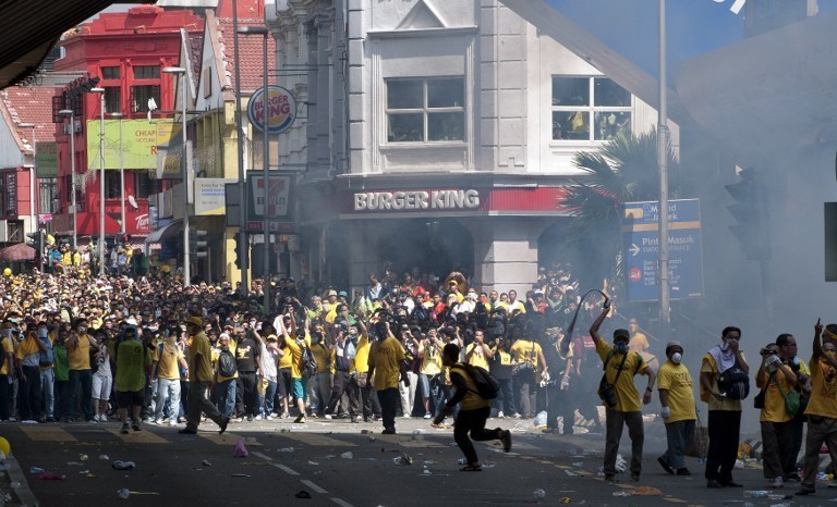 File photo of protestors challenging police during an anti-government rally near Dataran Merdeka in Kuala Lumpur on April 28, 2012. Thousands of protesters gathered in the Malaysian capital to demand electoral reforms, defying a lockdown of central Kuala 