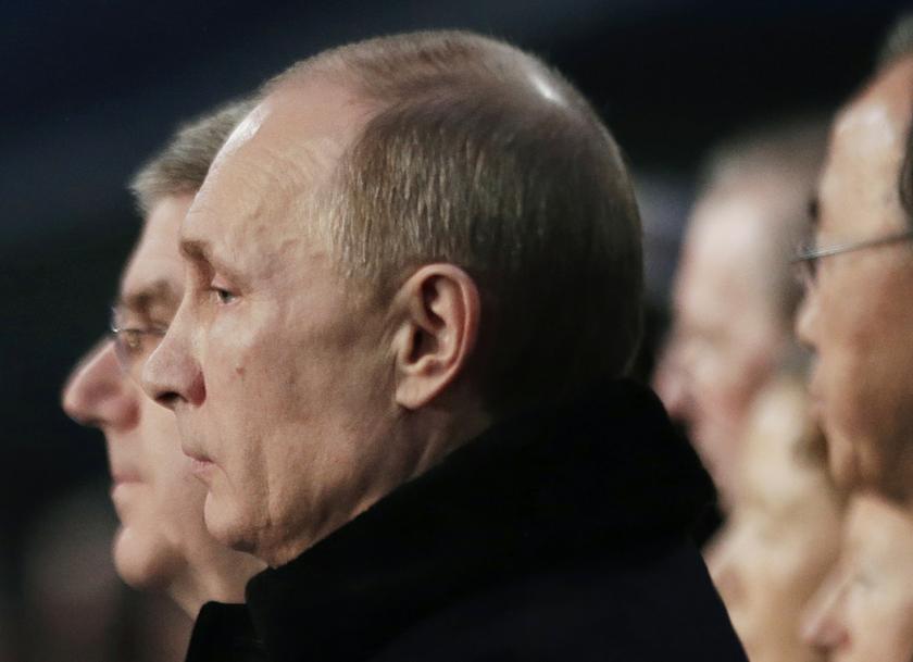 Russian President Vladimir Putin (centre) stands during the playing of the Russian national anthem at the opening ceremony of the 2014 Sochi Winter Olympics in Sochi, February 7, 2014. u00e2u20acu201d Reuters pic
