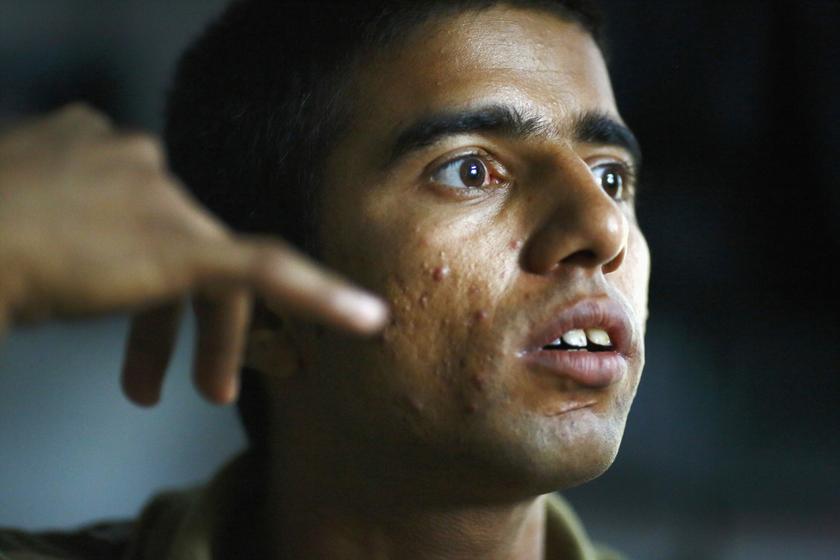 Raju Prasad Lamichhane during an interview in Telkot village, near Kathmandu October 1, 2013. His father, Shiva, worked 16-hour-days for a company in Qatar. In August last year, Shiva returned to his dormitory, vomited and passed out and died 19 days late